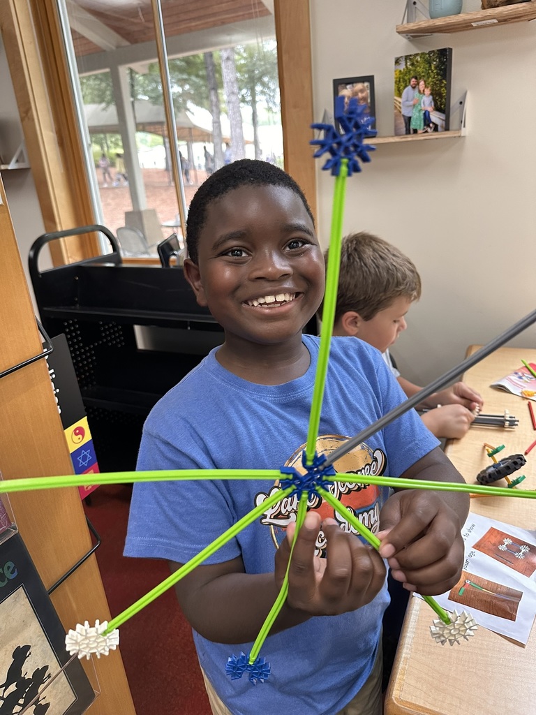 student building with legos