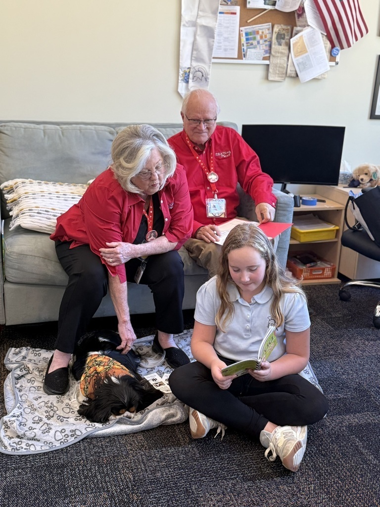 Student reading to dog
