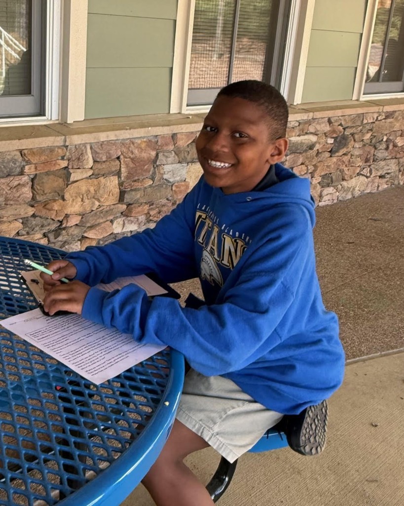 Student outside at new table