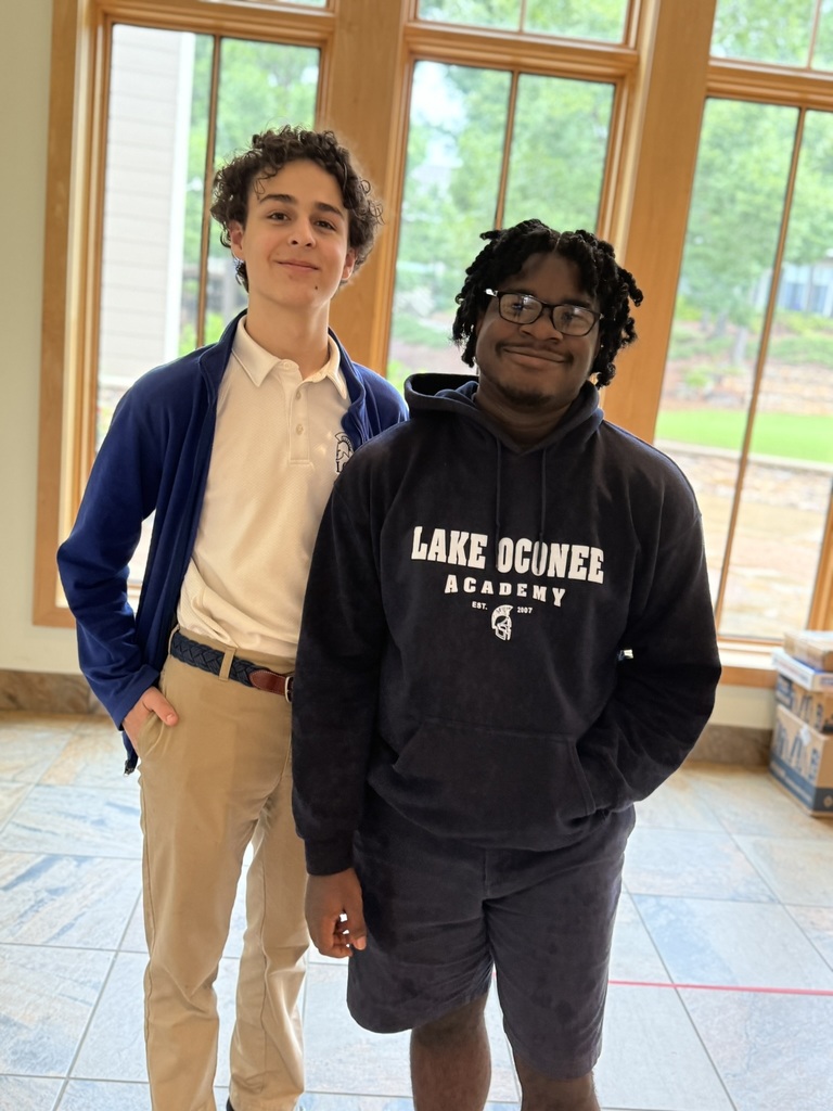 2 students together in the lobby