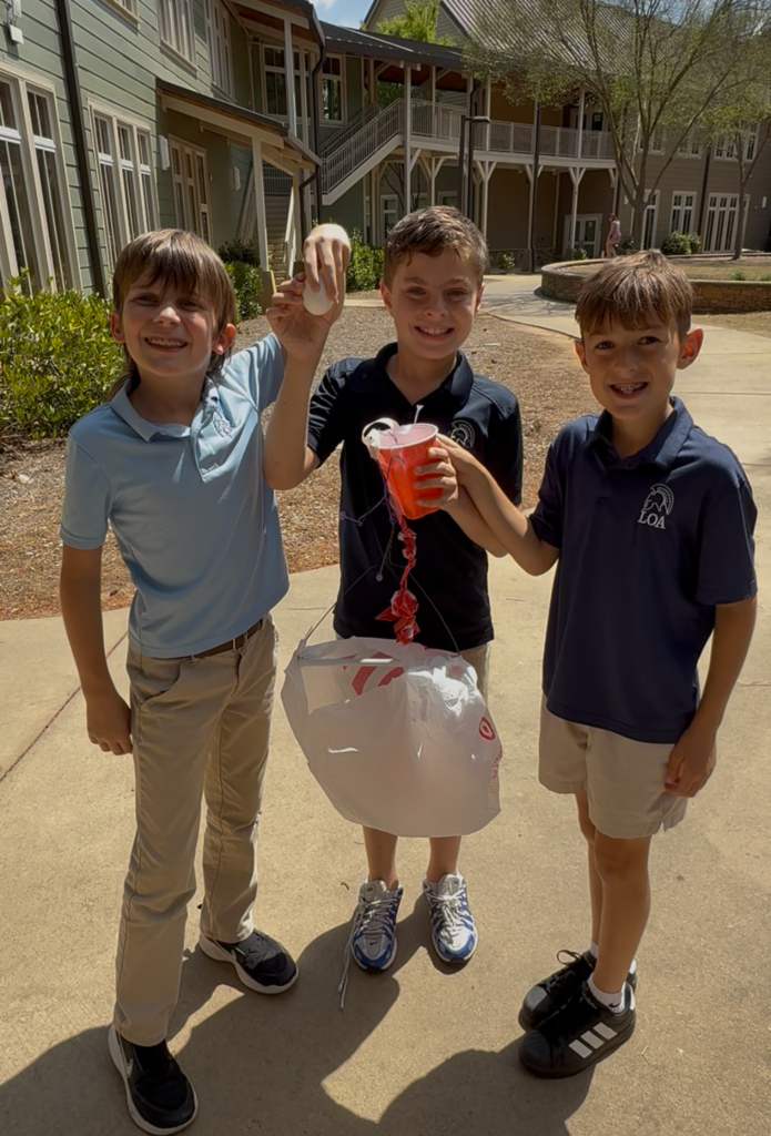 three boys in courtyard