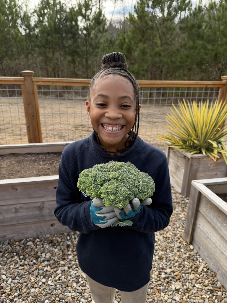 student with broccoli 