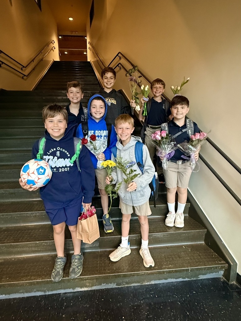 boys with flowers for teachers