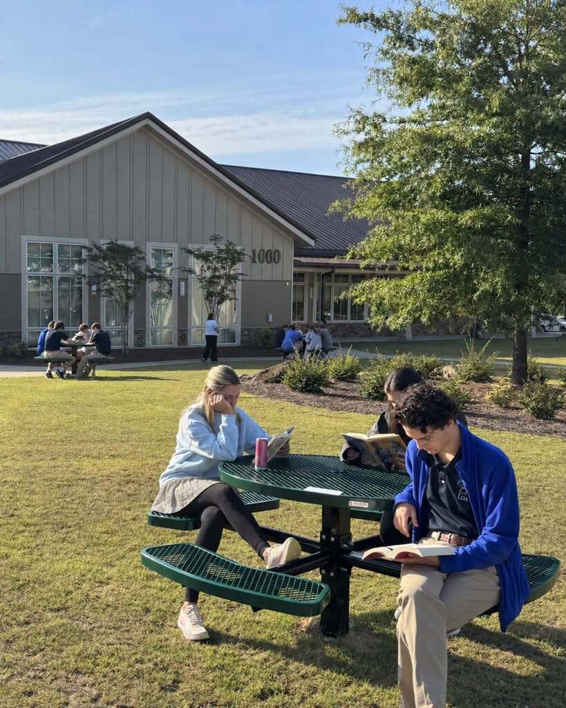 Students reading outside