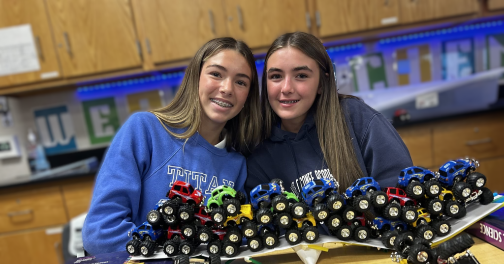two girls with bridge they built
