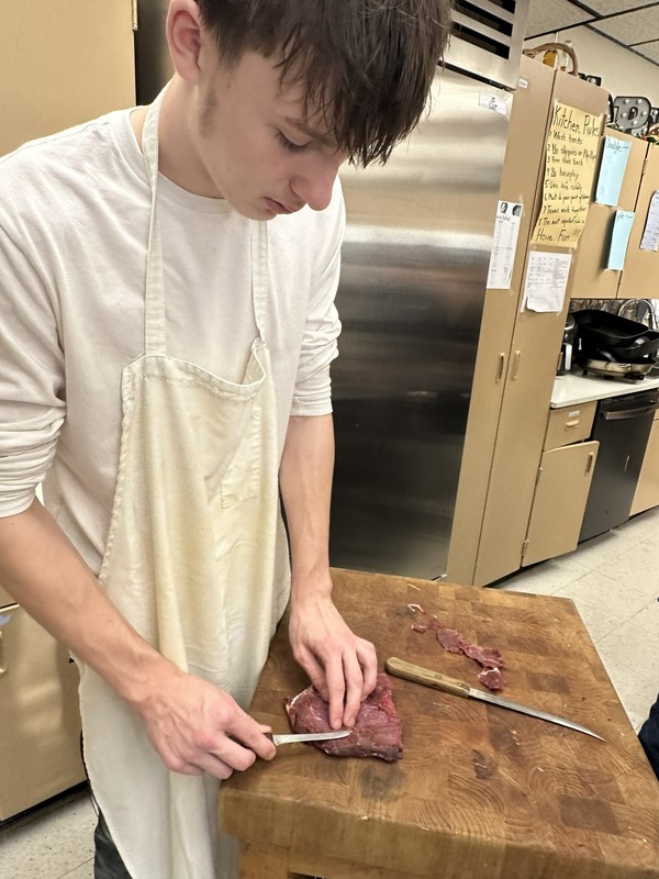 Culinary Class cutting elk steaks