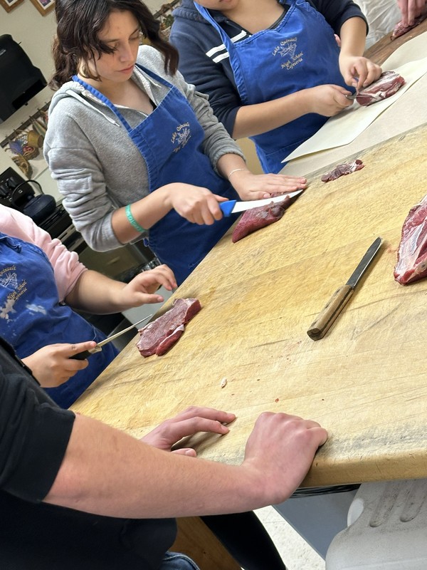 Culinary Class cutting elk steaks