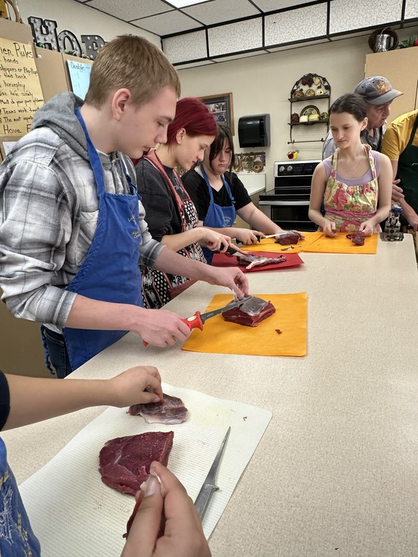 Culinary Class cutting elk steaks