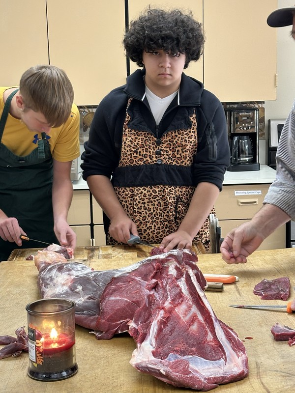 Culinary Class cutting elk steaks