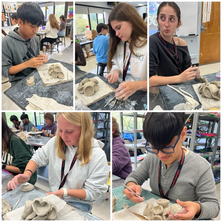 Ceramics 1 students working on their coral reef sculptures based on the work of ocean conservation activist & artist Courtney Mattison.
