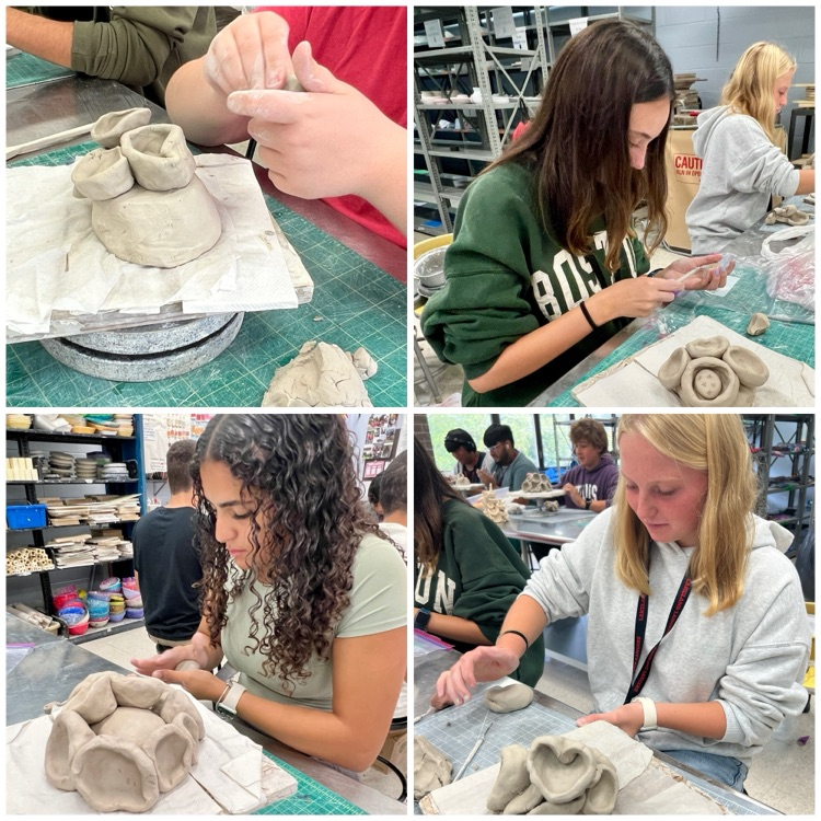 Ceramics 1 students working on their coral reef sculptures based on the work of ocean conservation activist & artist Courtney Mattison.