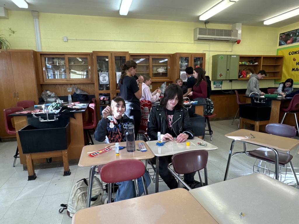 Service Club students make Christmas ornaments to send to troops and veterans.