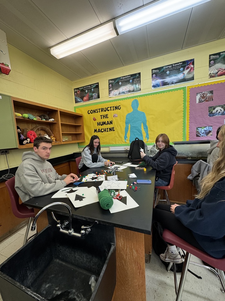 Service Club students make Christmas ornaments to send to troops and veterans.