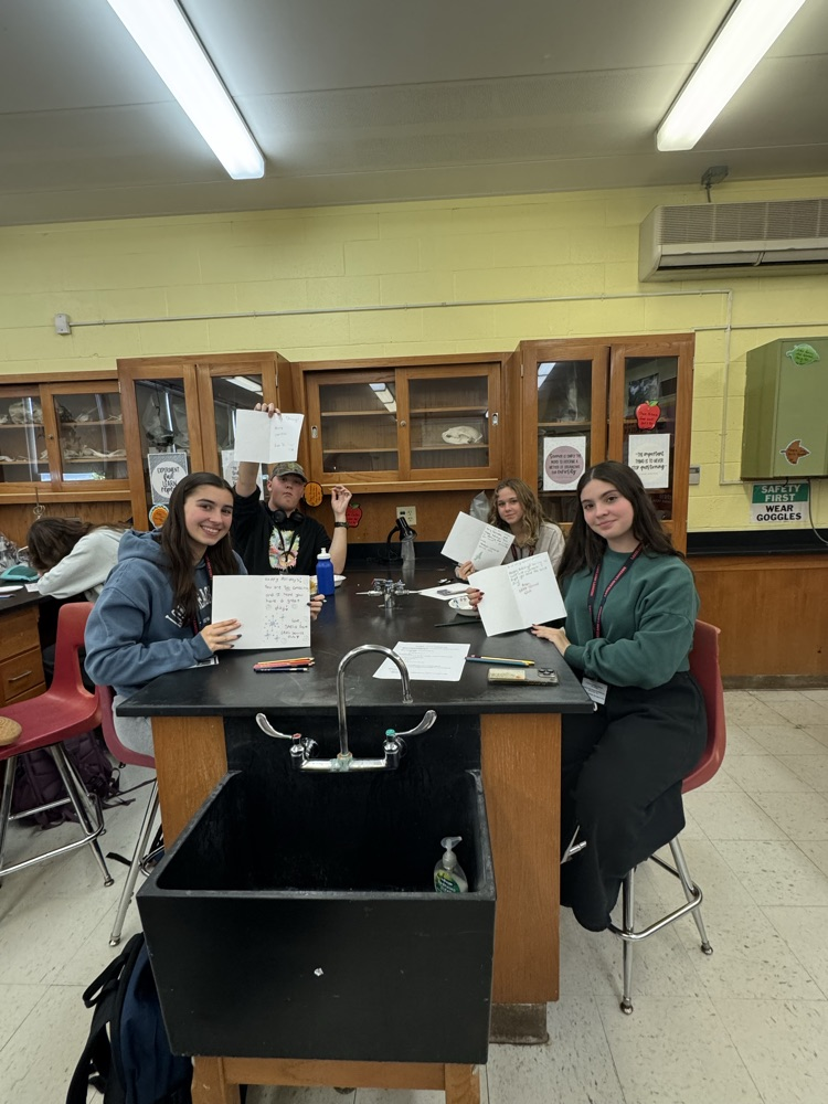 Service Club members showing off their holiday cards for hospitalized kids.