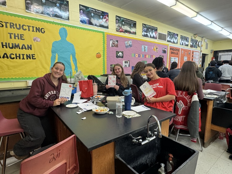 Service Club members showing off their holiday cards for hospitalized kids.
