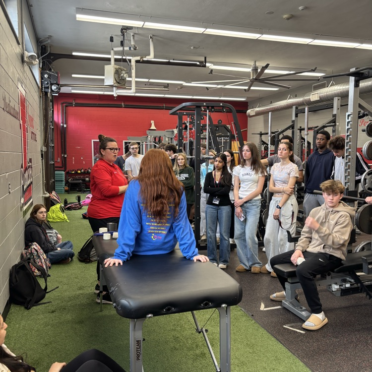 Mr. Cervino's Kinesiology class learning hands on taping methods from our Athletic Trainer Janell