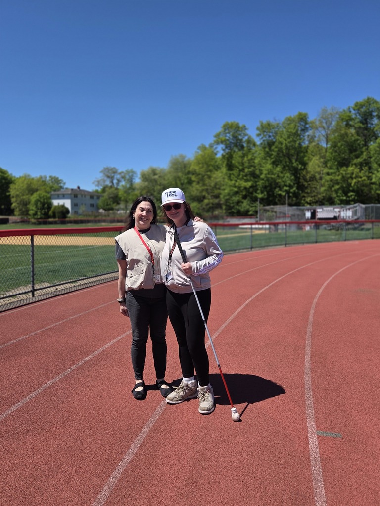 Students and teachers walk the track in a walkathon to raise money for The Seeing Eye of Morristown.