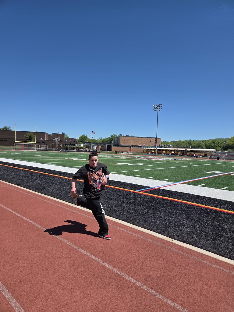 Students and teachers walk the track in a walkathon to raise money for The Seeing Eye of Morristown.