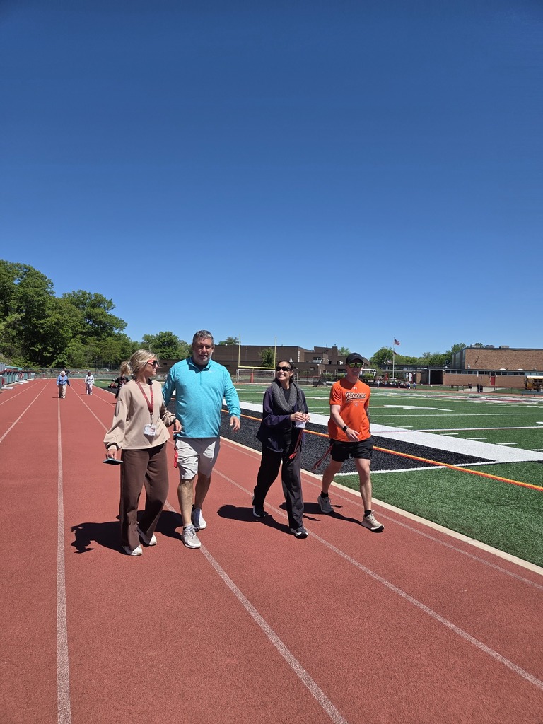 Students and teachers walk the track in a walkathon to raise money for The Seeing Eye of Morristown.