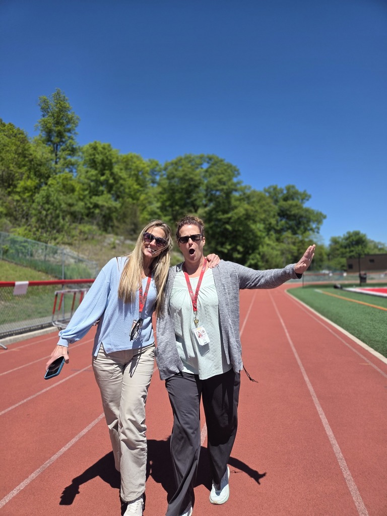 Students and teachers walk the track in a walkathon to raise money for The Seeing Eye of Morristown.