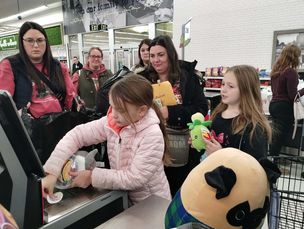 The Columbiaville Student Council hit the shops, spreading cheer for the Community Giving Tree!