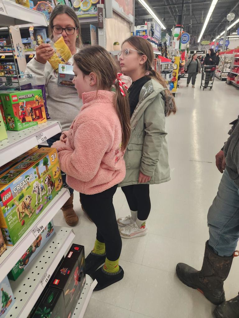 The Columbiaville Student Council hit the shops, spreading cheer for the Community Giving Tree!