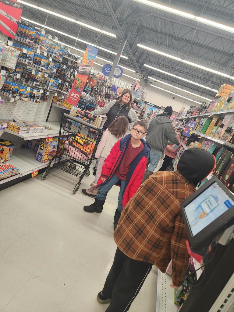 The Columbiaville Student Council hit the shops, spreading cheer for the Community Giving Tree!