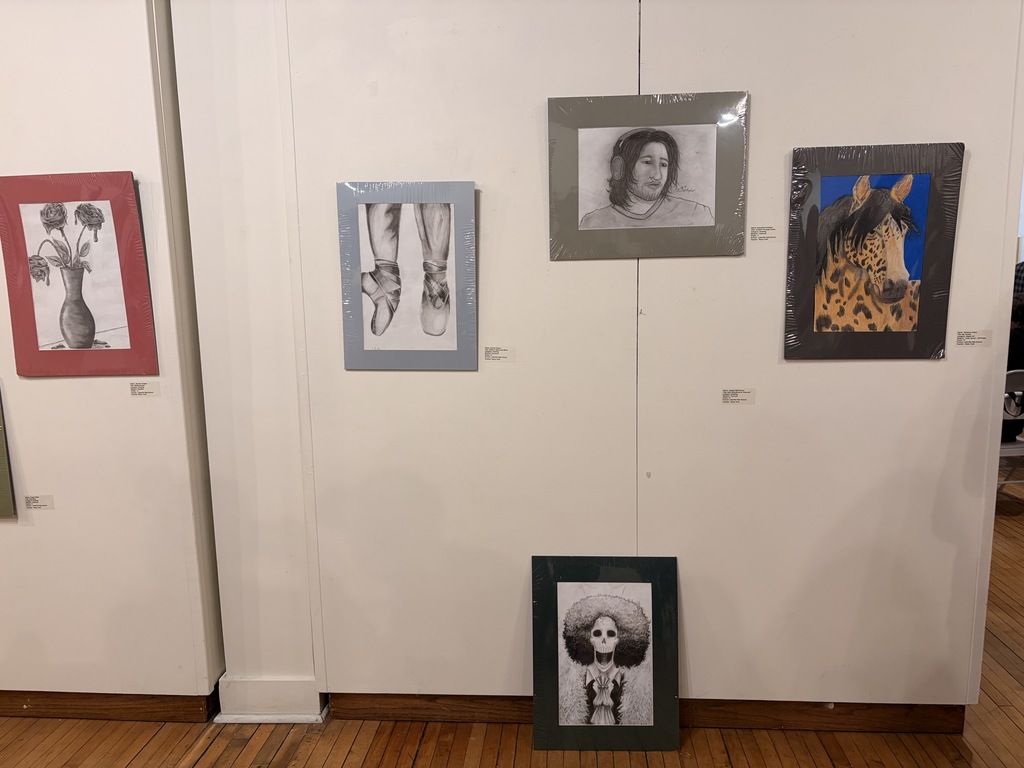 Student Artists who were able to make it to the show opening pictured with their work, Mariyah McNeil, Maddie Wilson, and Samantha Compton.