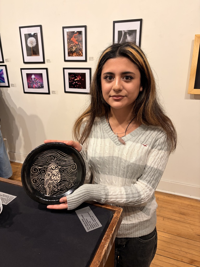 Student Artists who were able to make it to the show opening pictured with their work, Mariyah McNeil, Maddie Wilson, and Samantha Compton.