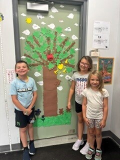 Photo of finished product - door covering with 3 children