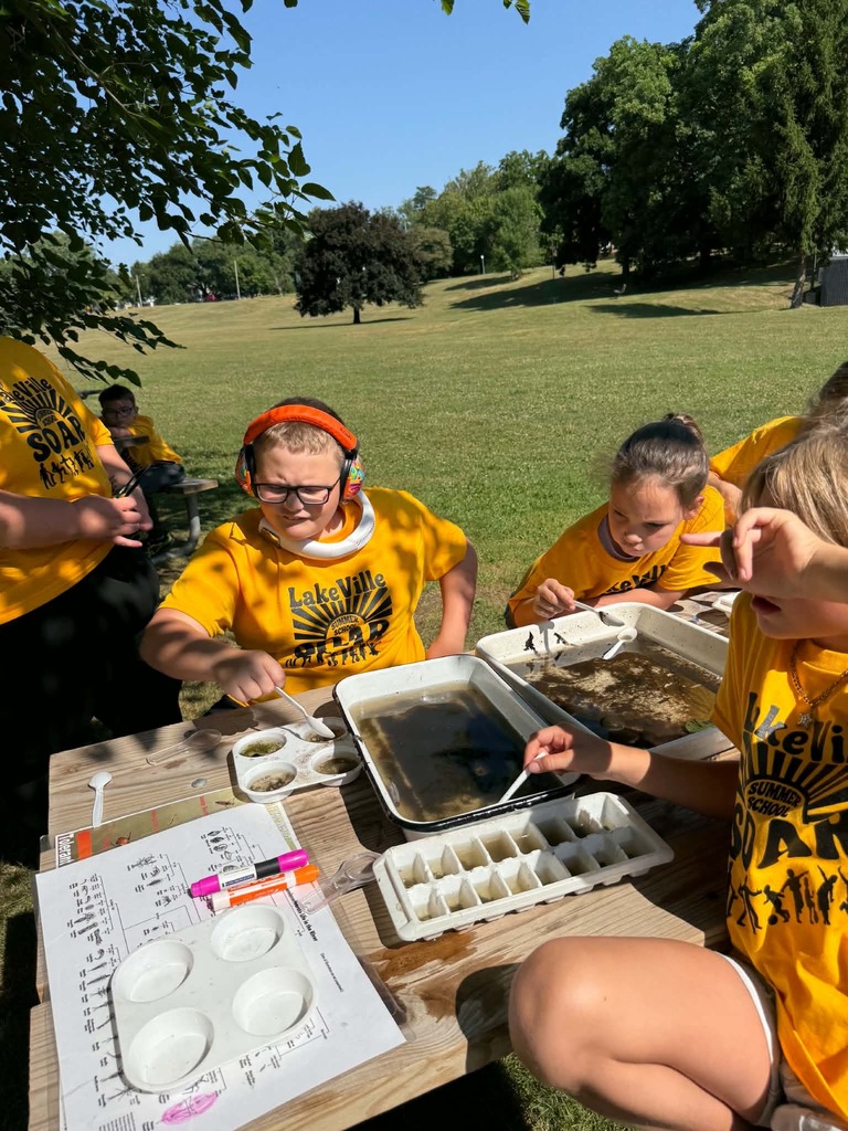 Photo of kids analyzing water