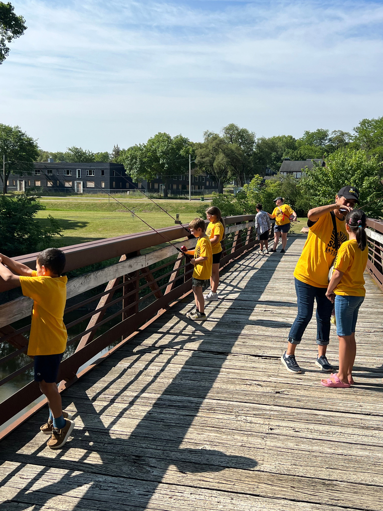 Photo of kids fishing on bridge