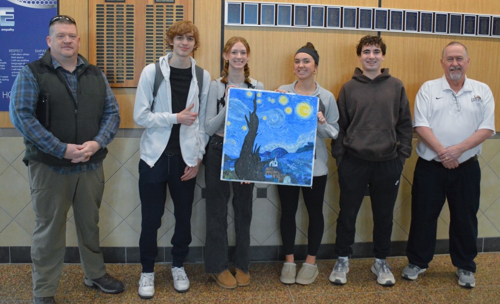 Board Member McArthur and High School Teacher Mr. Miller pictured with High School Art Students 