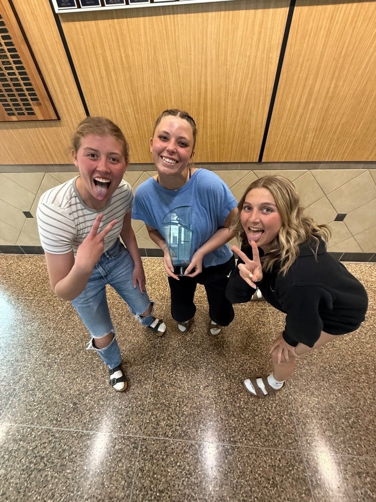 Three girls with award