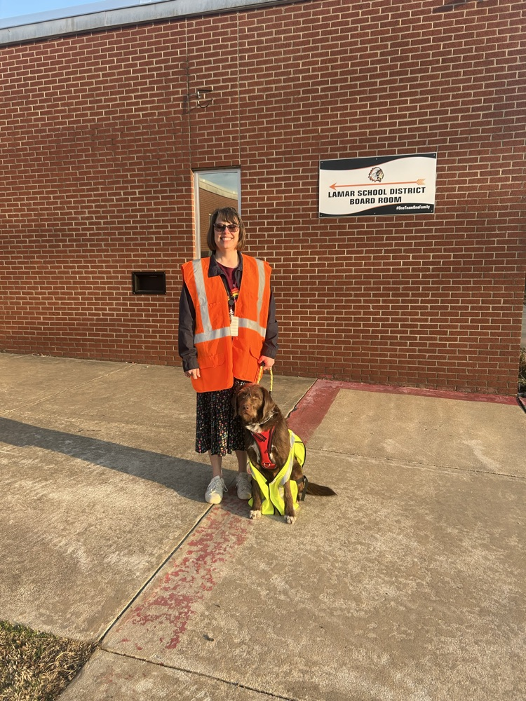 Mrs. Bratton and Marshall the therapy dog on car rider duty this morning. 