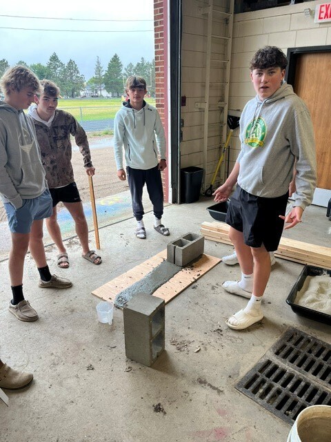 Students laying mortar bed