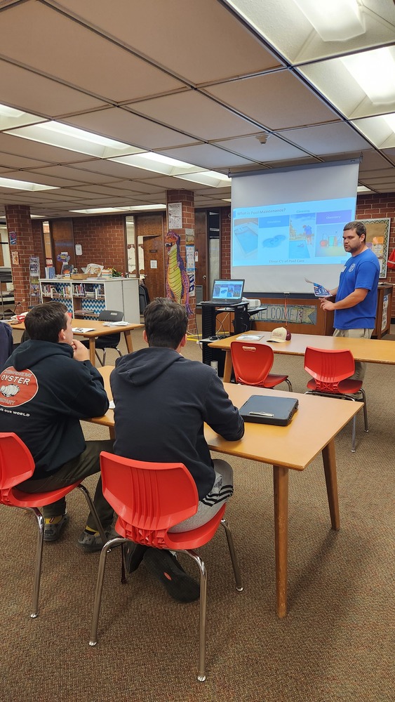 students in the lhs library during the presentation