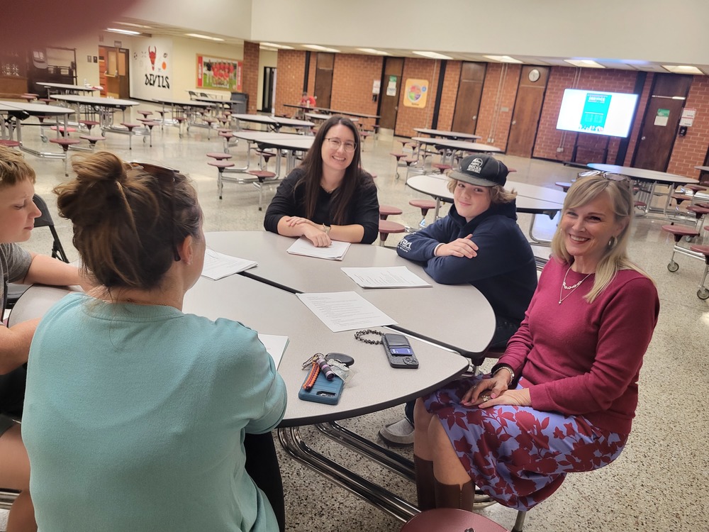 Jessica Davis with parents and students