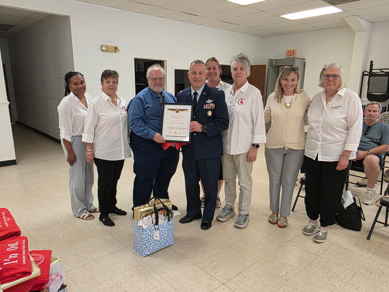 RG McManus recieving his award at the school board meeting.