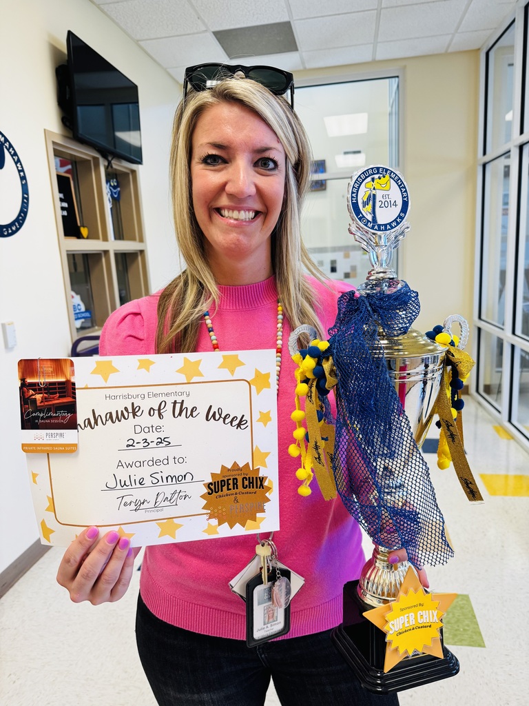 Julie Simon with the Tomahawk of the Week trophy