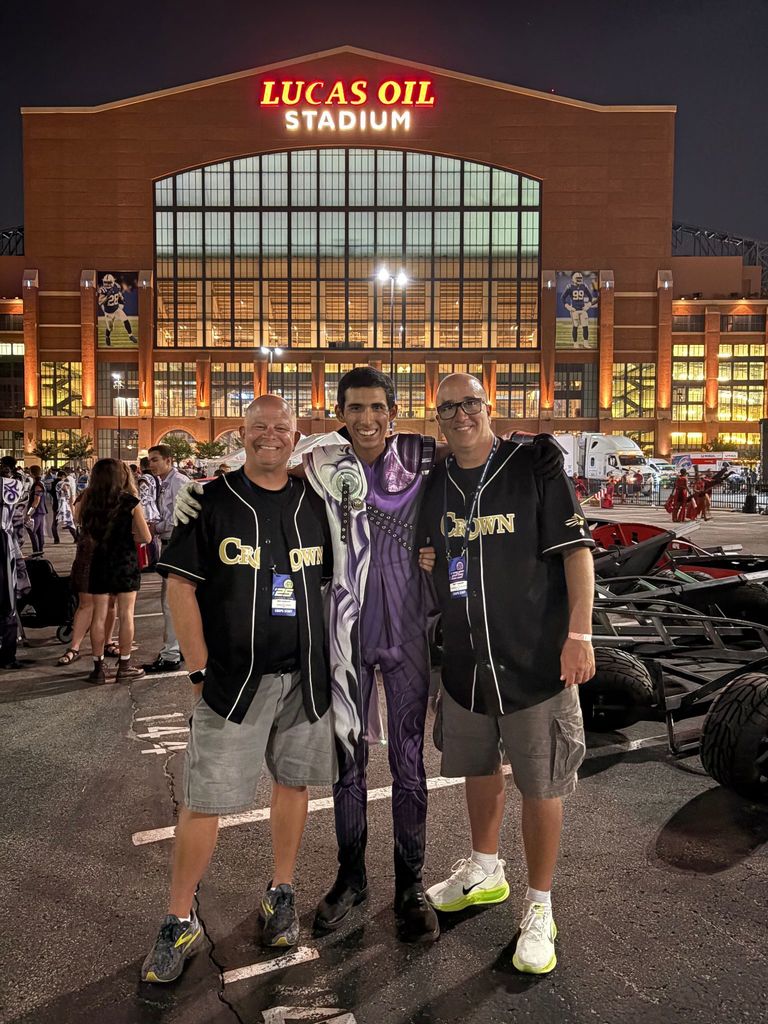 Isaac Segovia accompanied by Matt and Ben Harloff, brass captain heads for Carolina Crown.