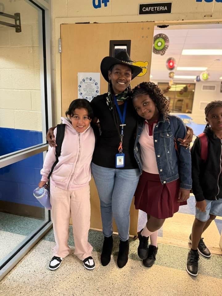 Students posing with teacher