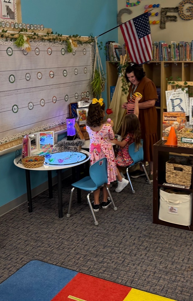 Teacher playing with students