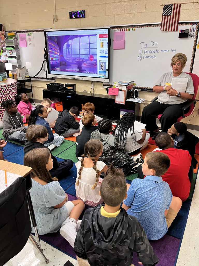 Teacher and students sitting in a classroom