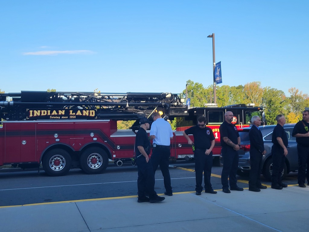 first responders from IL community in front of a fire truck