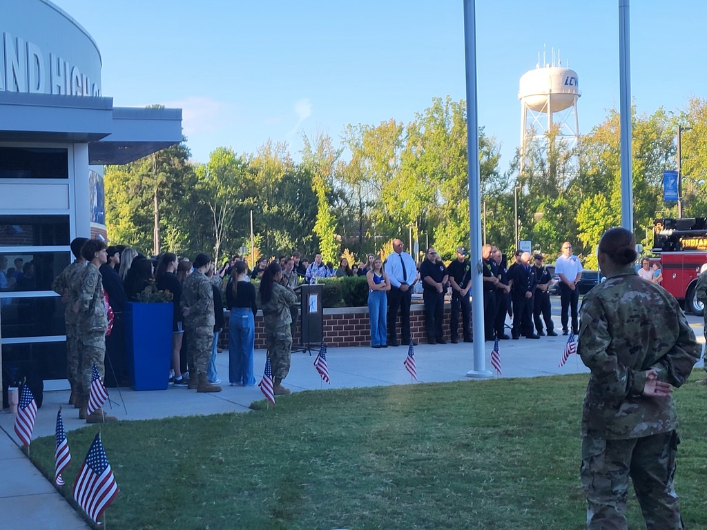 first responders from Indian Land community stand to be honored in front of ILHS and JROTC cadets