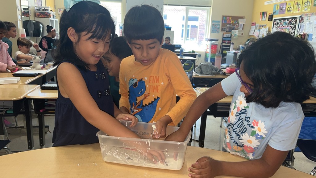 2nd graders making Oobleck