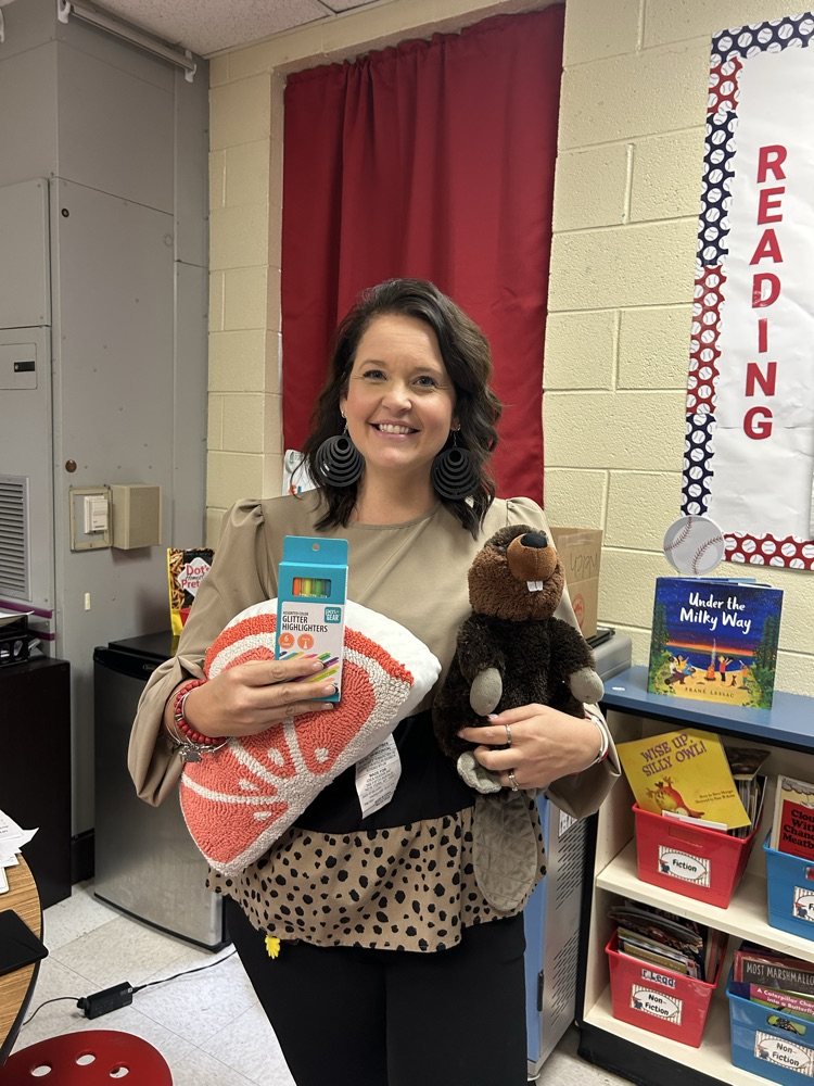 miss Chubb holding a stuffed beaver