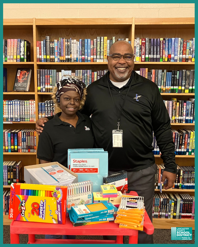 Afton Jackson, Site Supervisor at ILMS, presents Mr. Thorpe with a bundle of much-appreciated school supplies.