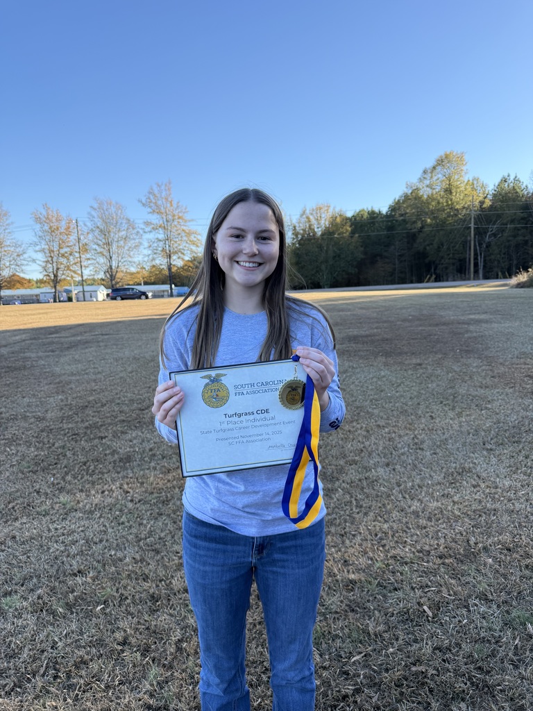 Paige L holds a printed certificate from the South Carolina FFA Association for the Turfgrass Career Development Even